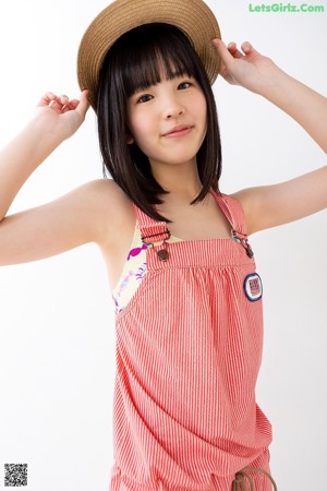 A young woman with long black hair and bangs posing for a picture.